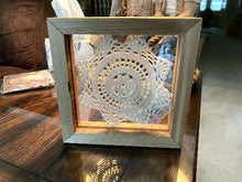 Load image into Gallery viewer, Crochet doily -  one of a kind wall hanging, or it can stand alone on any side -  wonderful gift country farmhouse decor - bedroom decor ideas for your home or a special gift - doily is vintage star pattern between 2 pieces of acrylic and framed in wood-  a piece of material to complement the doily - 7 1/8&quot; H x 7 1/8&quot; W x 1 1/4&quot; D- Borgmanns Creations - 2
