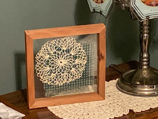 Crochet doily is one of a kind - gift for the farmhouse home decor - gift for mom, grandma, or aunt - the doily is between 2 pieces of acrylic and framed in wood - piece of material to complement doily - can hang from frame or stand alone,  9 3/4" H x 9 3/4" W x 1 1/4" D - Borgmanns Creations - 1
