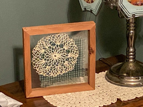 Crochet doily is one of a kind - gift for the farmhouse home decor - gift for mom, grandma, or aunt - the doily is between 2 pieces of acrylic and framed in wood - piece of material to complement doily - can hang from frame or stand alone,  9 3/4