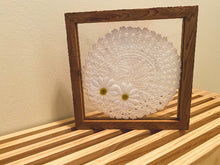 Load image into Gallery viewer, Crochet doily art one of a kind - white doily with 2 white flowers with green centers - wall hanging, or it can stand alone on any side - wonderful gift for the country farmhouse decor - bedroom decor ideas - doily is set between 2 pieces of acrylic and framed in wood. 10&quot; H x 10&quot; W x 1 1/4&quot; D - Borgmanns Creations - 1
