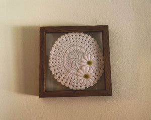 Crochet doily art one of a kind - white doily with 2 white flowers with green centers - wall hanging, or it can stand alone on any side - wonderful gift for the country farmhouse decor - bedroom decor ideas - doily is set between 2 pieces of acrylic and framed in wood. 10" H x 10" W x 1 1/4" D - Borgmanns Creations 