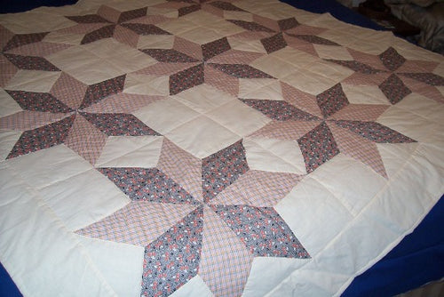 Eight Star Quilt,  All cotton pieces were hand stitched in the 1950's, and I finished putting on the backing by hand quilting in 1999, and it has poly filling in the center. 69