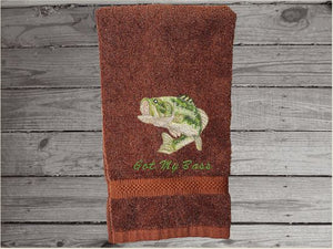 Brown nautical decorative hand towel of a big mouth bass for the beach or lake home, personalized house warming or birthday gift for the fisherman, to put with his fishing gear. The bass  is a great design for the bathroom/ kitchen decor. Embroidered on a terry premium soft and absorbent towel 16" x 27" - Borgmanns Creations - 3
