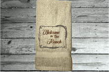 Load image into Gallery viewer, Beige Bath Hand Towel - embroidered saying &quot; Welcome To Our Ranch&quot; - western gifts - country farmhouse decor - new couple wedding gift - bathroom / kitchen - this terry towel can be a barn work towel - housewarming / birthday gift - Borgmanns Creations 1
