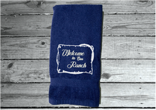 Load image into Gallery viewer, blue Bath Hand Towel - embroidered saying &quot; Welcome To Our Ranch&quot; - western gifts - country farmhouse decor - new couple wedding gift - bathroom / kitchen - this terry towel can be a barn work towel - housewarming / birthday gift - Borgmanns Creations 
