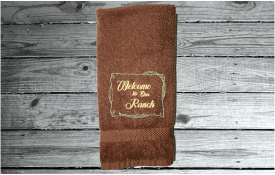 brown Bath Hand Towel - embroidered saying " Welcome To Our Ranch" - western gifts - country farmhouse decor - new couple wedding gift - bathroom / kitchen - this terry towel can be a barn work towel - housewarming / birthday gift - Borgmanns Creations 