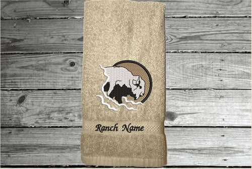 Beige hand towel embroidered Southwest decor with buffalo head will make the west come alive. A terry hand towel 16