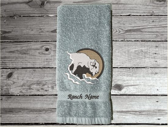 Gray hand towel embroidered Southwest decor with buffalo head will make the west come alive. A terry hand towel 16" x 27" is just the gift for the Southwest theme for bathroom or kitchen, to make the romance of the old west come alive. Will make a wonderful farmhouse housewarming gift or for your own home. decor - Borgmanns Creations - 4