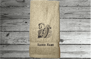 Beige hand towel western theme, embroidered wagon and horse head on a cotton terry towel, soft and absorbent, 16" x 27", the perfect western cowboy design for your gusts to enjoy while at your ranch of home, personalized home decor - Borgmanns Creations 