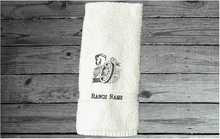 Load image into Gallery viewer, White hand towel western theme, embroidered wagon and horse head on a cotton terry towel, soft and absorbent, 16&quot; x 30&quot;, the perfect western cowboy design for your gusts to enjoy while at your ranch of home, personalized home decor - Borgmanns Creations 
