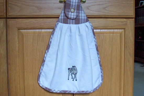 White kitchen hanging hand towel with embroidered horse - western farmhouse kitchen decor -  towel has a top of brown checkered material top is batting filled - ribbing around towel matching top - button for attaching to handle, 15" x 24" - he perfect gift for mom for her birthday gift to display in the kitchen - Borgmanns Creations - 1