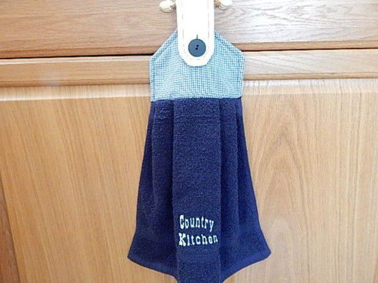 Blue kitchen hanging towel with embroidered saying " Country Kitchen "   -  country farmhouse kitchen decor -  gift for a friend or family member - cotton towel with cotton material for the top  14" x 15" with a 5" cotton print top and button to fasten - Borgmanns Creations - 1