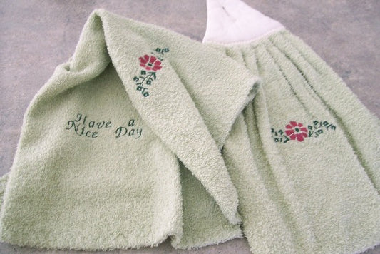 Green kitchen hand towel set - embroidered flower design for the kitchen decor - dish and hand towel set a gift for mom - embroidered flower on both towels and hand towel ( back side) is words "have a nice day" - cream color top, quilted material with a button hand towels 13" x 21" - hanging towel 16 1/2" x 13" - Borgmanns Creations - 1