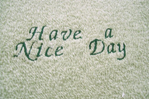 Green kitchen hand towel set - embroidered flower design for the kitchen decor - dish and hand towel set a gift for mom - embroidered flower on both towels and hand towel ( back side) is words "have a nice day" - cream color top, quilted material with a button hand towels 13" x 21" - hanging towel 16 1/2" x 13" - Borgmanns Creations - 3