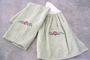 Green kitchen hand towel set - embroidered flower design for the kitchen decor - dish and hand towel set a gift for mom - embroidered flower on both towels and hand towel ( back side) is words "have a nice day" - cream color top, quilted material with a button hand towels 13" x 21" - hanging towel 16 1/2" x 13" - Borgmanns Creations - 5