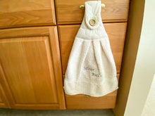 Load image into Gallery viewer, Beige hanging towel - perfect Christmas gift for mom with embroidered words Silver Bells for her kitchen decor - It can also be hooked over a bathroom cabinet handle - home decor premium terry towel is 16&quot; wide - 21&quot; long - Borgmanns Creations - 1
