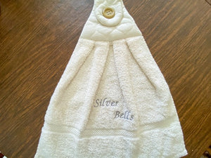 Beige hanging towel - silver bells - perfect Christmas gift for mom with embroidered words Silver Bells for her kitchen decor - It can also be hooked over a bathroom cabinet handle - home decor premium terry towel is 16" wide - 21" long - Borgmanns Creations - 3