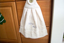 Load image into Gallery viewer, Beige hanging towel - silver bells - perfect Christmas gift for mom with embroidered words Silver Bells for her kitchen decor - It can also be hooked over a bathroom cabinet handle - home decor premium terry towel is 16&quot; wide - 21&quot; long - Borgmanns Creations - 4
