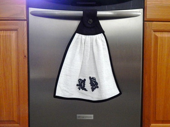 Kitchen hanging towel - embroidered cowboy and cowgirl heads - terry towel with black quilted top, edged with bias tape, embroidered design and dark button 15" wide - 18" long - farmhouse decor gift for mom with the country flair kitchen decor - hangs over oven handle or cabinet handle - Borgmanns Creations - 3