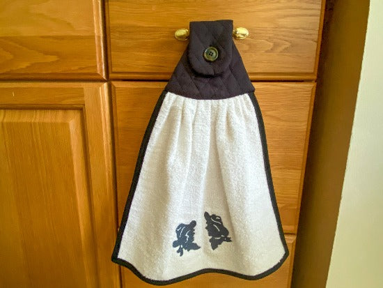 Kitchen hanging towel - embroidered cowboy and cowgirl heads - terry towel with black quilted top, edged with bias tape, embroidered design and dark button 15" wide - 18" long - farmhouse decor gift for mom with the country flair kitchen decor - hangs over oven handle or cabinet handle - Borgmanns Creations - 4