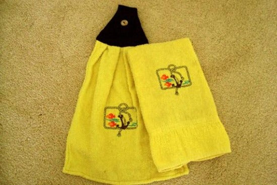 Yellow kitchen towel set - embroidered anchor and fish design for the kitchen - design is embroidered on both towels hand towel also has the words 