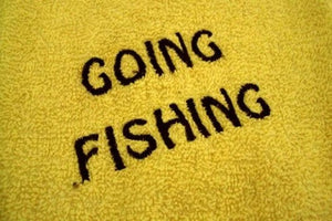 Yellow kitchen towel set - embroidered anchor and fish design for the kitchen - design is embroidered on both towels hand towel also has the words "going fishing" - the top of hanging towel is black quilted material with button - fisherman can keep it with fishing equipment - hand towel 13" x 22" - hanging towel 16 1/2" x 13" - Borgmanns Creations - 5