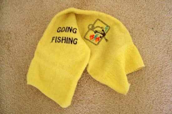 Yellow kitchen towel set - embroidered anchor and fish design for the kitchen - design is embroidered on both towels hand towel also has the words "going fishing" - the top of hanging towel is black quilted material with button - fisherman can keep it with fishing equipment - hand towel 13" x 22" - hanging towel 16 1/2" x 13" - Borgmanns Creations - 3