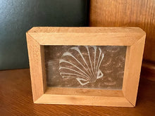 Load image into Gallery viewer, Laser engraved etching with backing of a sea shell - home decor gift for the nautical theme - gift for mom or wife -  birthday present, mothers day gift, special occasion etc. - 1/2 inch thick acrylic - 5 inch x 6 3/4 inch - brown floral material in background, framed in wood, free standing - Borgmanns Creations - 1
