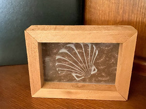 Laser engraved etching with backing of a sea shell - home decor gift for the nautical theme - gift for mom or wife -  birthday present, mothers day gift, special occasion etc. - 1/2 inch thick acrylic - 5 inch x 6 3/4 inch - brown floral material in background, framed in wood, free standing - Borgmanns Creations - 1