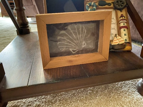 Laser engraved etching with backing of a sea shell - home decor gift for the nautical theme - gift for mom or wife -  birthday present, mothers day gift, special occasion etc. - 1/2 inch thick acrylic - 5 inch x 6 3/4 inch - brown floral material in background, framed in wood, free standing - Borgmanns Creations - 2
