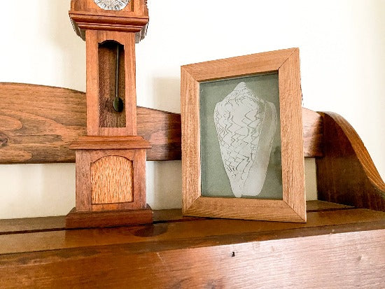 Laser engraved etching of a sea shell -  nautical gift for mom or wife for home decor - great decoration for the lake home or cottage - 1/2 inch thick acrylic,  5 inch x 6  3/4 inch - green acrylic background, framed in wood, free standing - Borgmanns Creations - 1