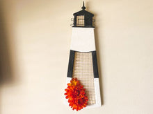 Load image into Gallery viewer, Wall art wood lighthouse wall hanging for the lake home decor, 1/2&quot; MDF board, hand painted, with wire, material and flowers to accent design, 18&quot; H x  61/4 &quot; x  W 1/2&quot; D, custom gift for the lighthouse collector - Borgmanns Creations 

