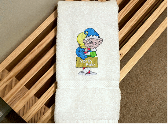 White Hand Towel - North Pole Christmas hand towel embroidered design of a pixie gift for mom - Christmas decoration for her bathroom decor or kitchen decor, for the holidays - terry towel soft and absorbent 16