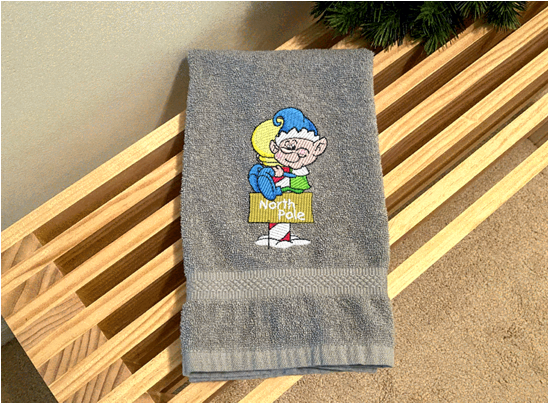 Gray Hand Towel - North Pole Christmas hand towel embroidered design of a pixie gift for mom - Christmas decoration for her bathroom decor or kitchen decor, for the holidays - terry towel soft and absorbent 16" x 27" -  gift for a friend, personalized new home gift  -Borgmanns Creations 