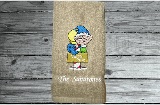 Beige hand towel - North Pole Christmas hand towel embroidered design of a pixie gift for mom - Christmas decoration for her bathroom decor or kitchen decor, for the holidays - terry towel soft and absorbent 16" x 27" -  gift for a friend, personalized new home gift  -Borgmanns Creations 