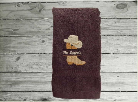 Brown hand towel Martex Staybright Hospitality Towels ringspun cotton loops. Durable soft and absorbent, finished edges with decorative band. Embroidered with a custom design, these luxury towels will make a wonderful bathroom gift for any bathroom. terry towel 16" x 27" embroidered design of cowboy boot and hat with a personalized name. - Borgmanns Creations - 1
