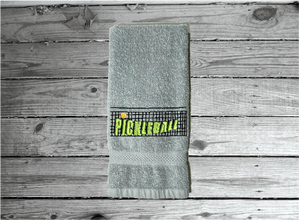 Gray Pickleball sports towel, terry hand towel soft and absorbent 16" x 27" - custom embroidered  design of a net with the word Pickleball, will make the perfect gift for the Pickleball player as a welcome to the team or for your partner. Personalize it just for them as a birthday or anniversary gift - Borgmanns Creations 