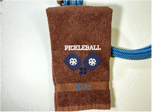 Brown Pickleball hand towel - embroidered rackets and ball on a terry towel soft and absorbent 16" x 27", for the hard playing player. Personalized gift for a special person or for the teem. Birthday gift for mom or dad. Borgmanns Creations 2