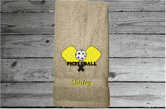 Beige Pickleball hand towel, embroidered rackets and ball on a terry towel 16" x 27" for the hard playing player. Personalized gift for a special person or for the teem. Birthday gift for mom or dad. Borgmanns Creations  3