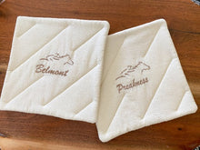 Load image into Gallery viewer, Pot holder set, 2 layers of Insul-Bright in the center of 2 pieces of unbleached muslin with embroidered race track names,  7&quot; x 7&quot;, great gift for mom&#39;s kitchen decor, embroidered for the cook at the outdoor BBQ pit, or the chef indoors - Borgmanns Creations 
