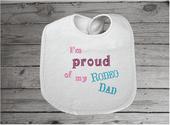 Bib burp cloth set embroidered Rodeo Dad design - baby shower gift farmhouse decor - wonderful gift set for a new born or toddler - Bib has flannel top with terry backing is 13" in over all length, 7 1/4" from neck to bottom and 8 3/4" at widest point - sticky fasteners - burp cloth is tri fold diaper - Borgmanns Creations 2