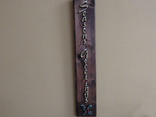 Load image into Gallery viewer, Seasons Greetings wall hanging - Christmas decor gift for mom - wood wall plaque - laser cut lauan wood glued to a 1&quot; beveled edge wood with mahogany stain, hanging hook on back - housewarming gift teacher gift -  gift for a coworker - 20&quot; x 3 1/2&quot; - Borgmanns Creations
