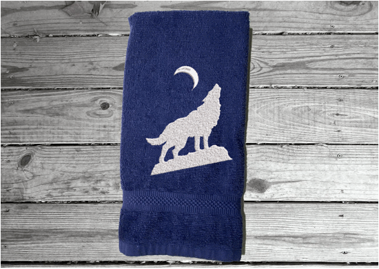 Blue wolf hand towel, beautiful design of a howling wolf under the moon, embroidered on a terry towel,  soft and absorbent, 16" x 27", a home decor addition for a farmhouse bathroom, kitchen for guest bath - Borgmanns Creations 