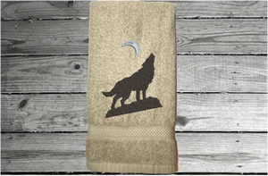 Beige wolf hand towel, beautiful design of a howling wolf under the moon, embroidered on a terry towel,  soft and absorbent, 16" x 27", a home decor addition for a farmhouse bathroom, kitchen for guest bath - Borgmanns Creations 