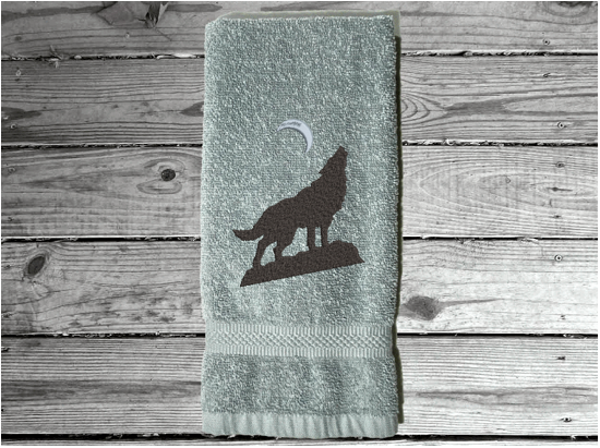 Gray wolf hand towel, beautiful design of a howling wolf under the moon, embroidered on a terry towel,  soft and absorbent, 16" x 27", a home decor addition for a farmhouse bathroom, kitchen for guest bath - Borgmanns Creations 