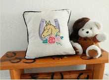 Load image into Gallery viewer, Throw pillow cover, neutral color material, 18&quot; x 18&quot;, black piping around edge, embroidered horseshoe with flowers western decor, wedding gift,  bed pillow for new couple in their country home. A wonderful gift for the man cave or birthday gift for the horse overs - Borgmanns Creations 
