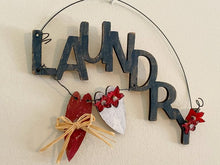 Load image into Gallery viewer, Rustic wood door sign, one of a kind laundry design, wall hanging or laundry door sign, laser cut luan wood, acrylic paint, layered wood,  wire, flowers, 7&quot; H x 8&quot; W x 1/4&quot; D, has red and white hanging hearts, as a gift farmhouse decor, housewarming idea for a friend - Borgmanns Creations 
