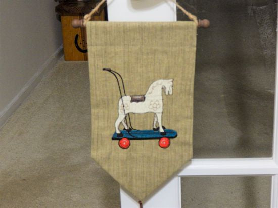 Horse wall hanging tapestry - green brown -  embroidered old fashioned rocking horse - backing of polyester hung on a dowel rod and has a twine hanger -  tassel at bottom -  farmhouse decor gift for mom -nursery decor door hanger - Borgmanns Creations 2