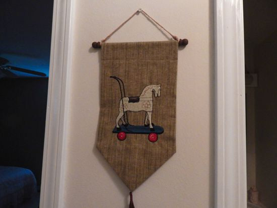 Horse wall hanging tapestry - green brown -  embroidered old fashioned rocking horse - backing of polyester hung on a dowel rod and has a twine hanger -  tassel at bottom -  farmhouse decor gift for mom -nursery decor door hanger - Borgmanns Creations 4