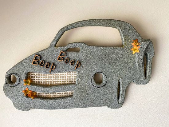 Wooden wall art wall hanging, 1/2" MDF board, layered wood, luan laser cut words ( Beep Beep), hand painted, wire, flowers, material for grill and head lights, 10" H x 17" W x 1/2" D, this cute wall art would make a wonderful baby shower gift for the family of car lovers.  Light weight for hanging on the wall - Borgmanns Creations 